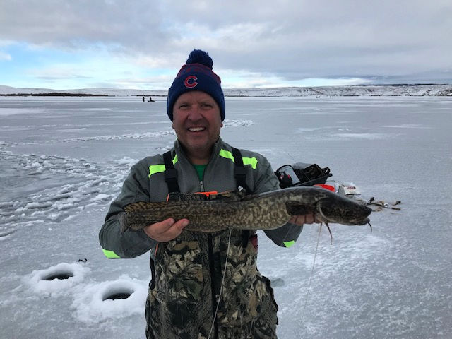 Jeff Hanson, of Grand Junction, CO, holding a burbot caught through the ice on Flaming Gorge on January 19, 2019.